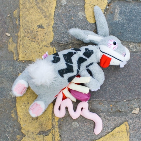 Plush rabbit roadkill